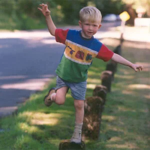 child balancing on one foot