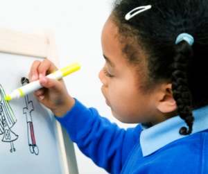 girl drawing stick figures