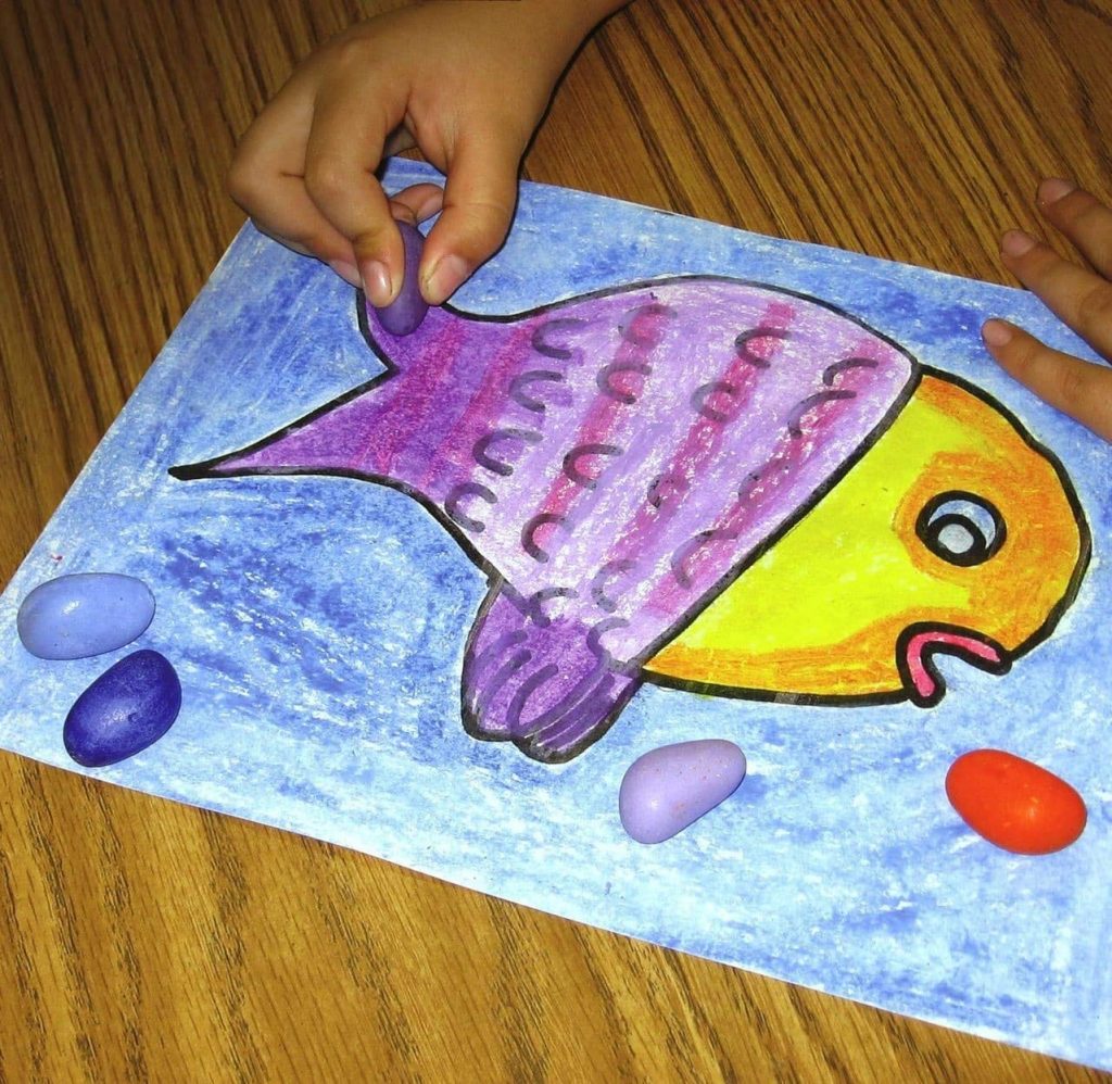 drawing of a fish made with rock crayons
