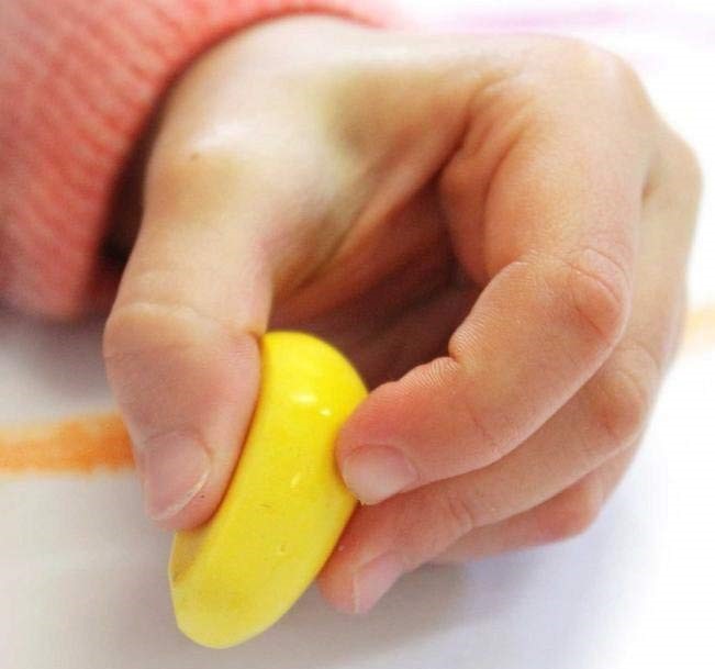 child holding rock crayon